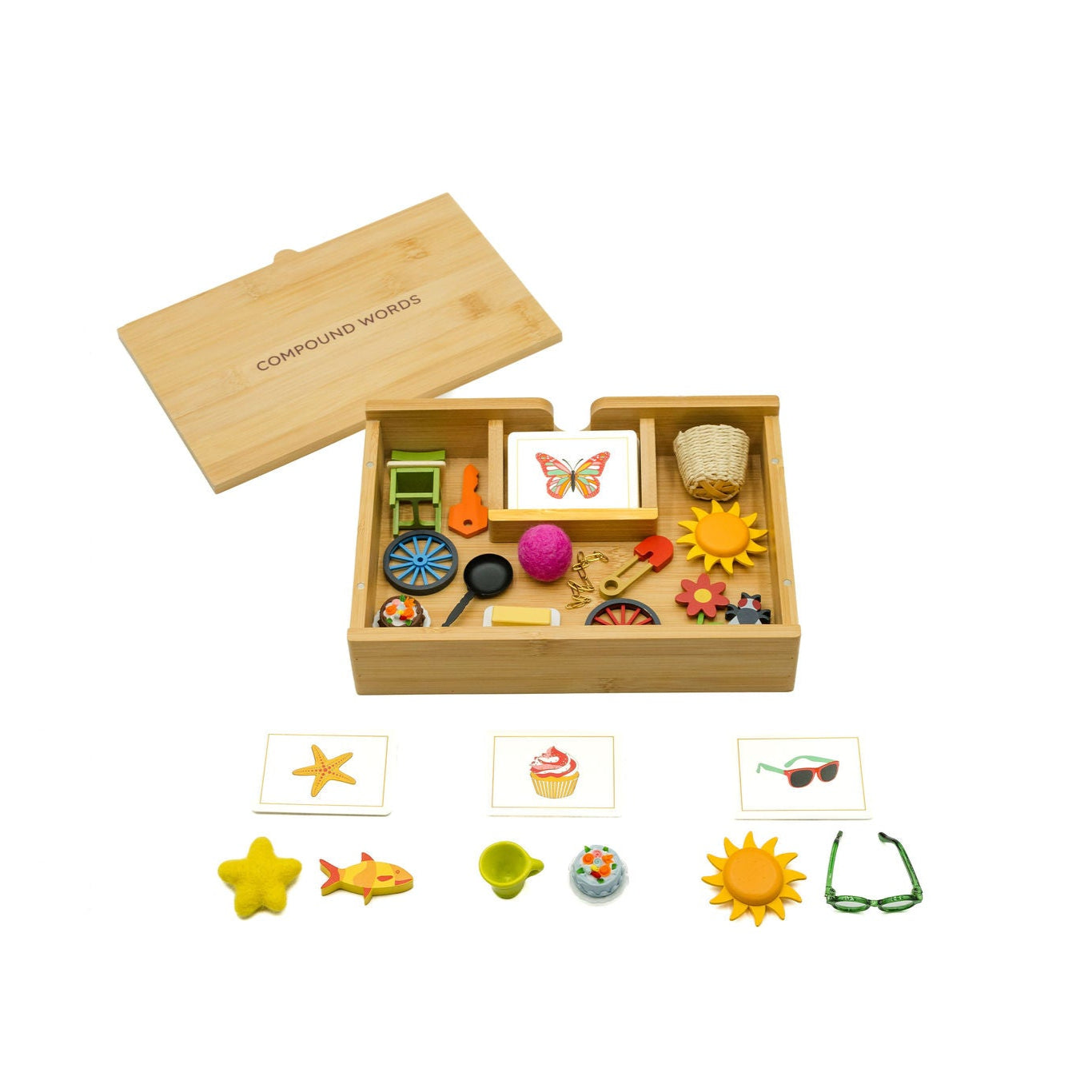 Wooden toy set with various small toys and matching cards on a white background.